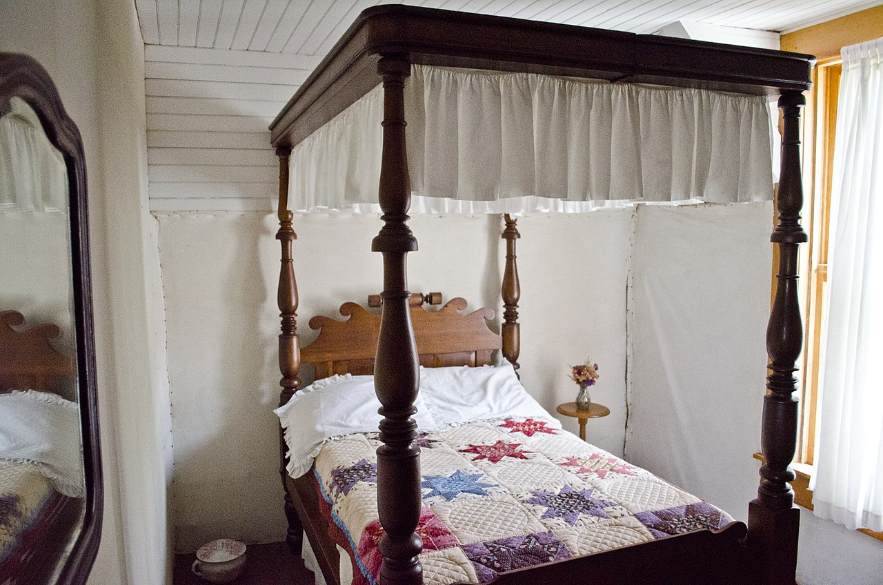 Historic four-poster, bed made